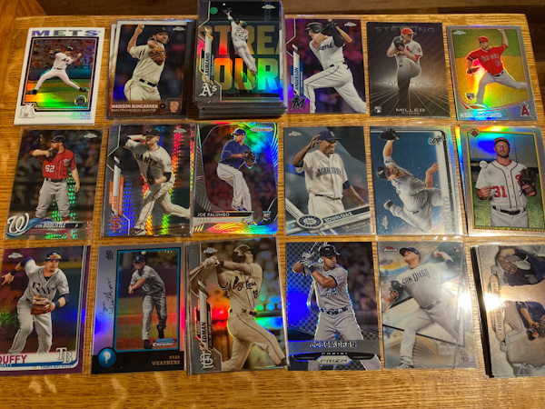 A selection of "refractor" and "prizm" baseball cards, featuring a rainbow effect over the images.