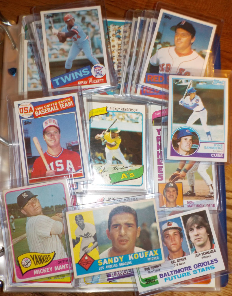 A selection of some of my favorite Topps baseball cards. This includes a 1960 Sandy Koufax, 1965 Mickey Mantle, 1982 Cal Ripken Jr, 1985 Mark McGwire, Roger Clemens, and Kirby Puckett, and 1983 Ryne Sandberg.
