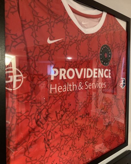 A framed and autographed jersey for the Portland Thorns